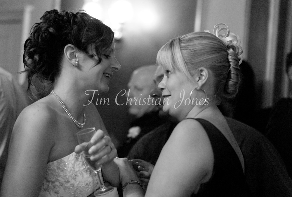 Bride chatting close with a friend