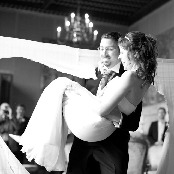 Bride Alexandra shares a quiet smile carried through the wedding surprise heart