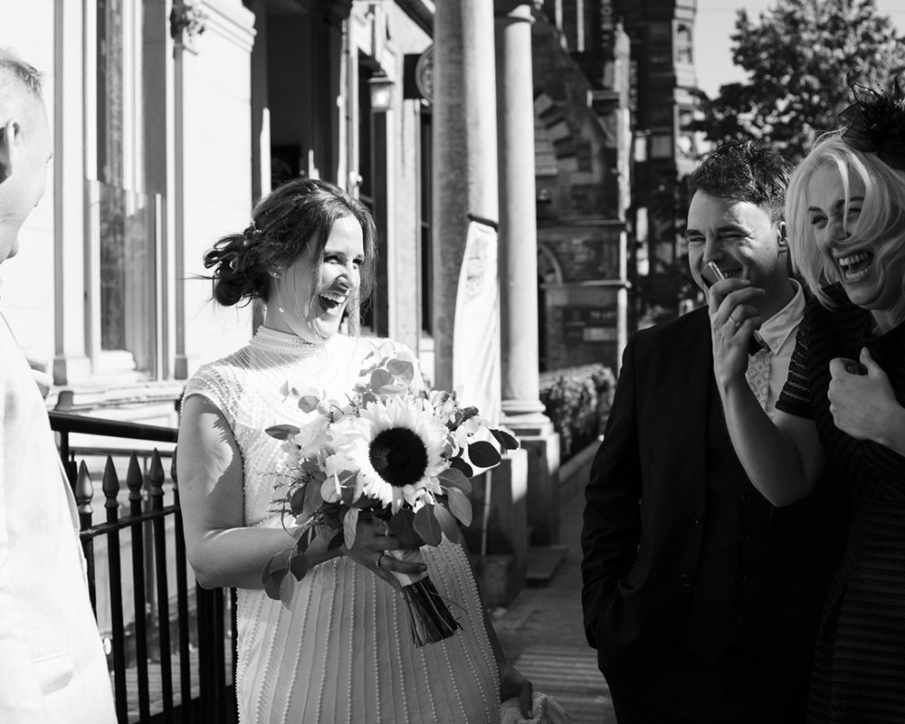 Leeds Wedding Photographer | Candid, Warm & Wonderfully Real 6 Wedding guests laughing, candidly captured.
